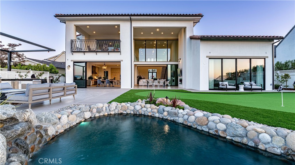 a view of a house with a yard porch and sitting area