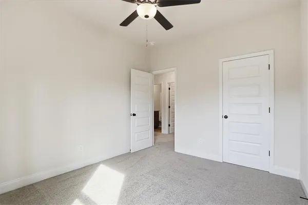 a view of room with ceiling fan