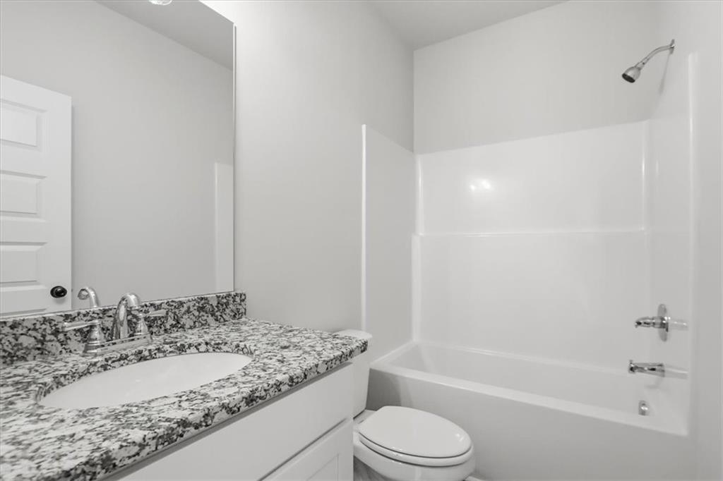 51 Wright Street, Unit 66 Lavonia, GA 30553 - Photo 30 of 47 a bathroom with a granite countertop sink toilet and shower