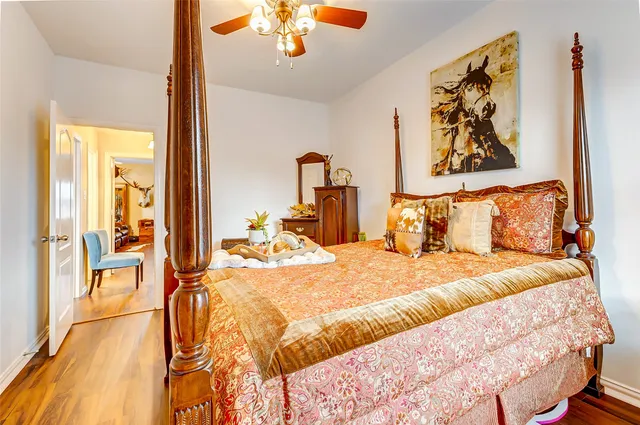 a bedroom with a bed and a chandelier