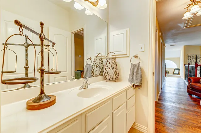 a bathroom with a sink and a mirror