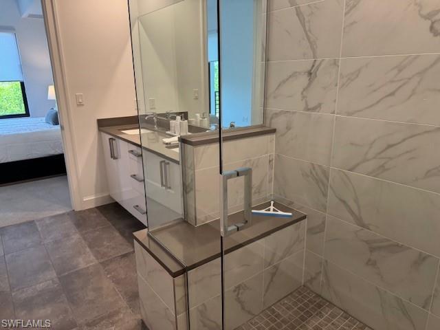1125 Central Avenue, Unit 461 Naples, FL 34102 - Photo 5 of 19 a bathroom with a sink and a mirror
