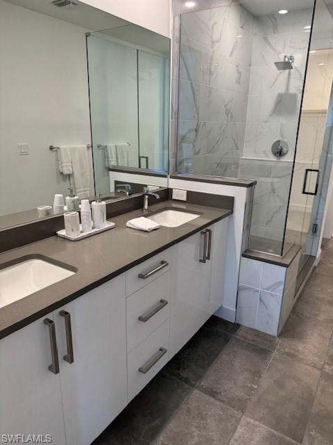 1125 Central Avenue, Unit 461 Naples, FL 34102 - Photo 6 of 19 a bathroom with a double vanity sink and mirror