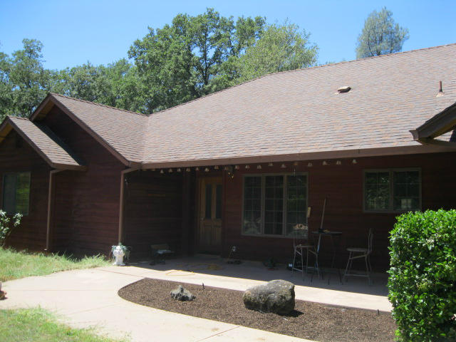 a house with trees in the background