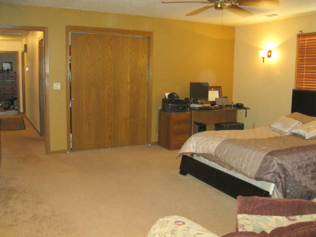 10786 Deschutes Road Palo Cedro, CA 96073 - Photo 16 of 24 a bedroom with a bed and a table