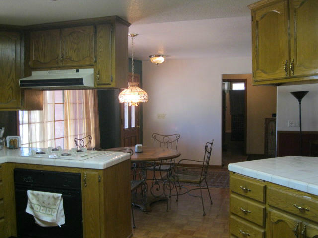 10786 Deschutes Road Palo Cedro, CA 96073 - Photo 5 of 24 a kitchen with a sink cabinets and window