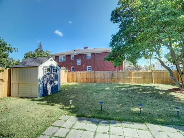 a view of backyard with garden and entertaining space