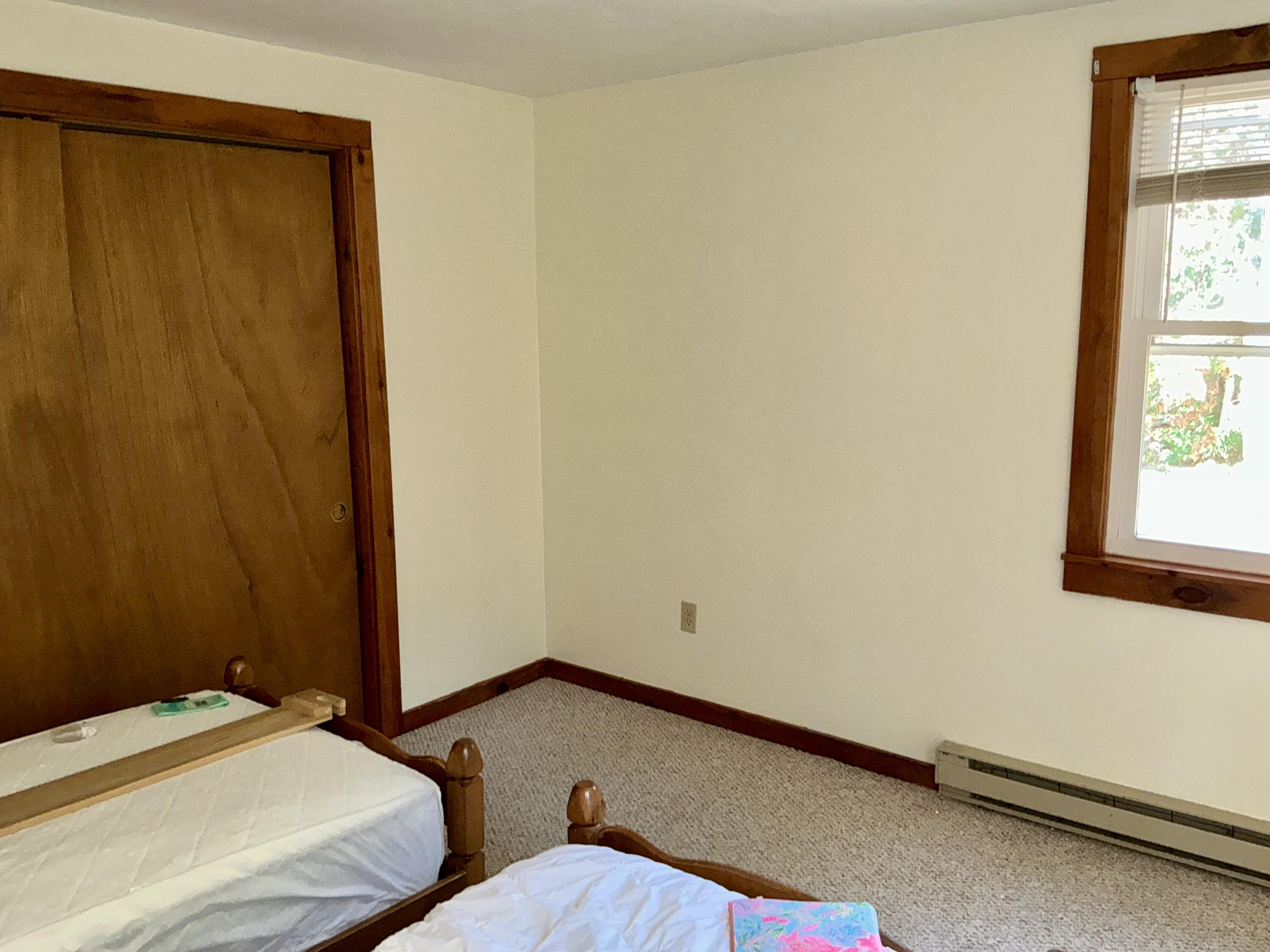 300 Falmouth Road, Unit 7E Mashpee, MA 02649 - Photo 11 of 27 a bedroom with a bed and a window