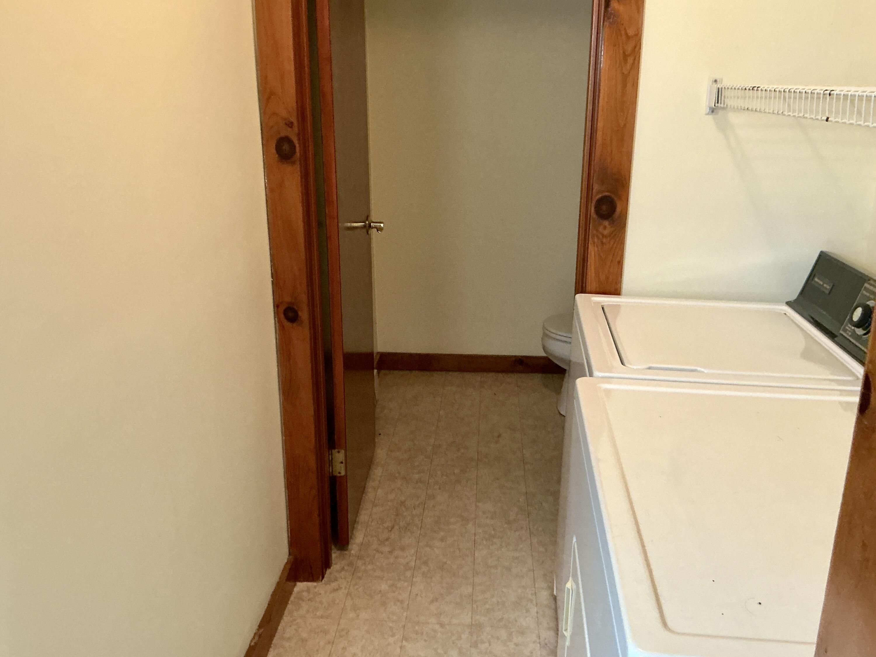 300 Falmouth Road, Unit 7E Mashpee, MA 02649 - Photo 18 of 27 a utility room with dryer and washer