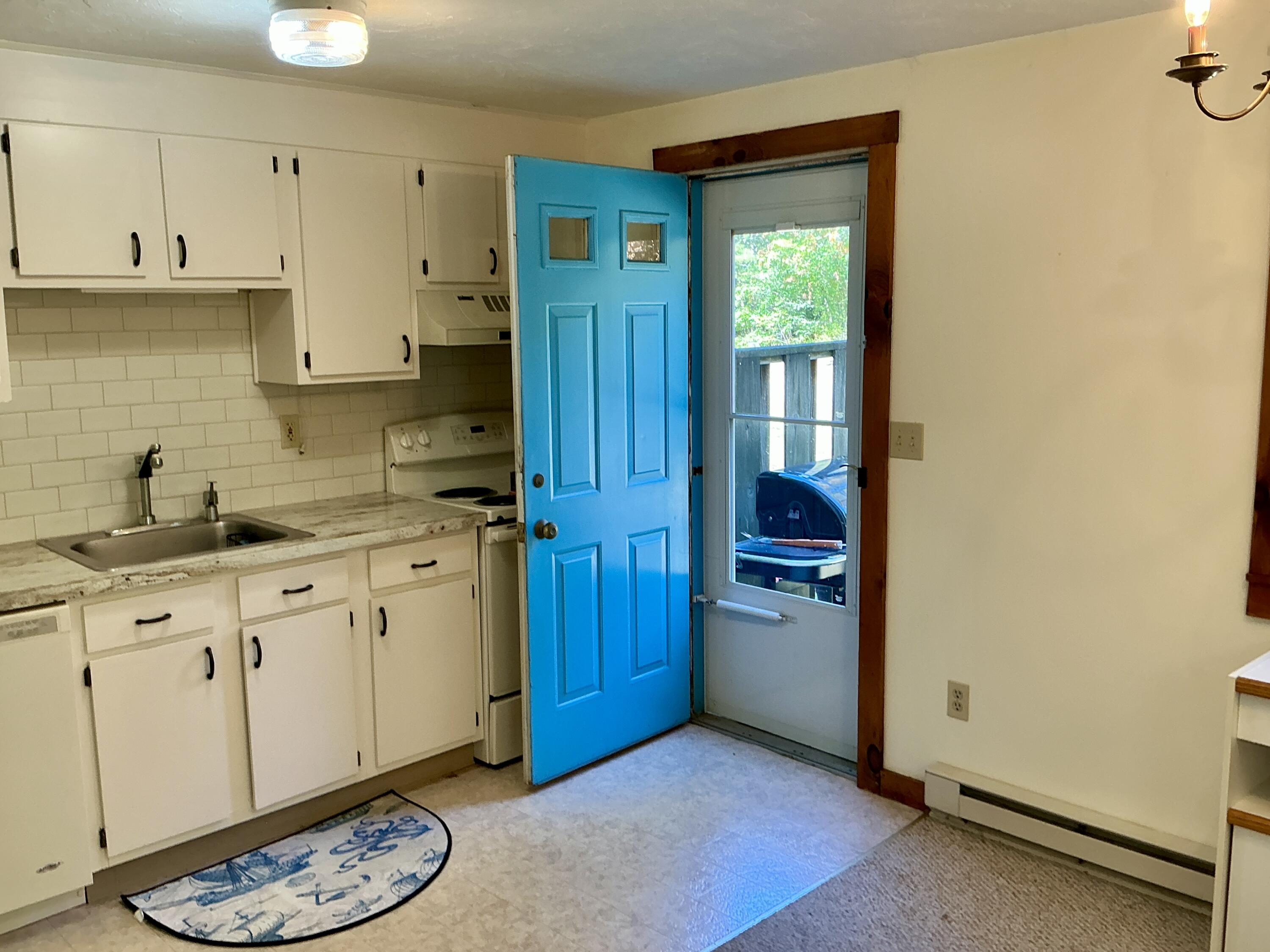 300 Falmouth Road, Unit 7E Mashpee, MA 02649 - Photo 21 of 27 a kitchen with granite countertop cabinets and appliances