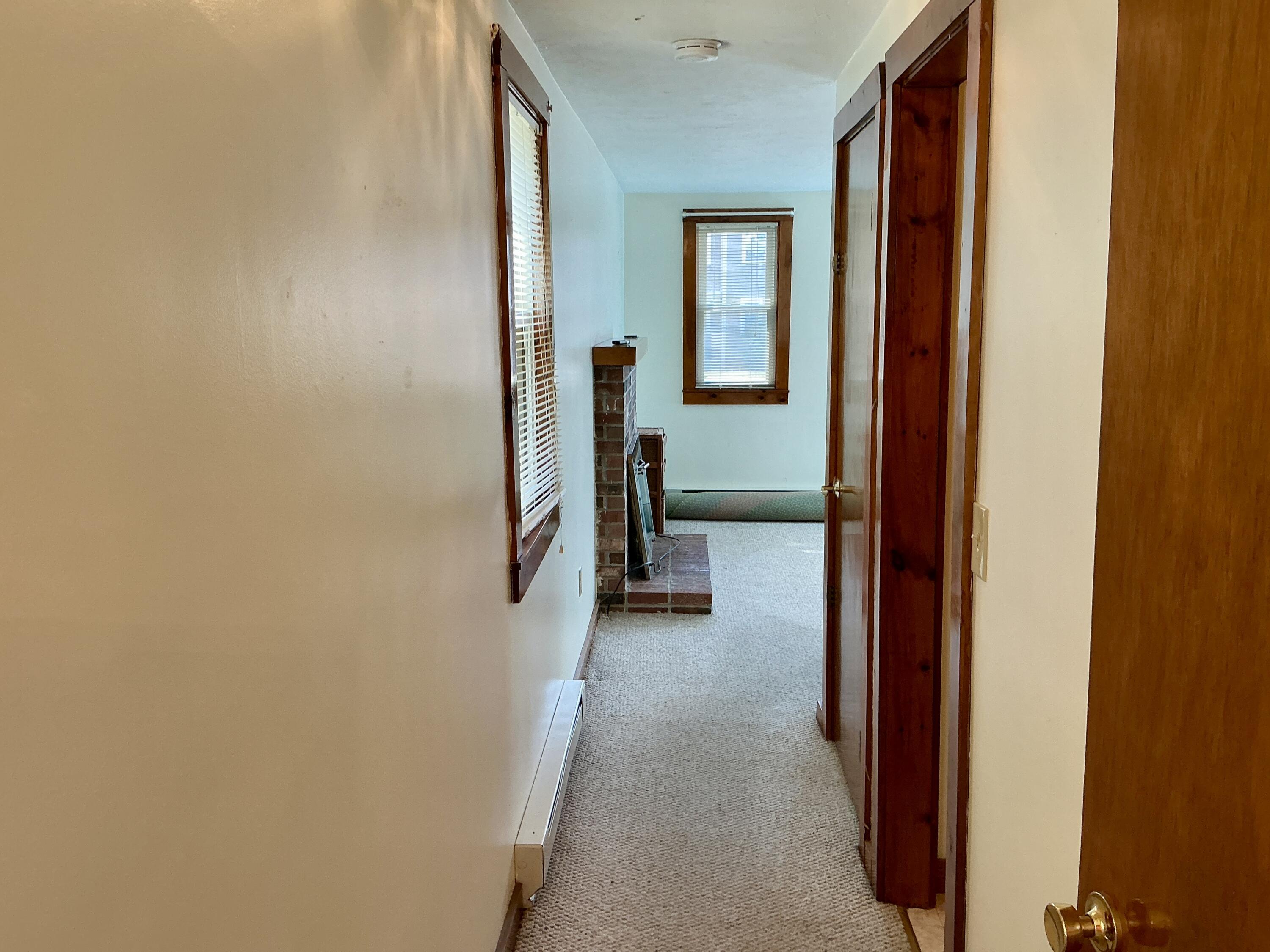 300 Falmouth Road, Unit 7E Mashpee, MA 02649 - Photo 22 of 27 a view of a livingroom from a hallway