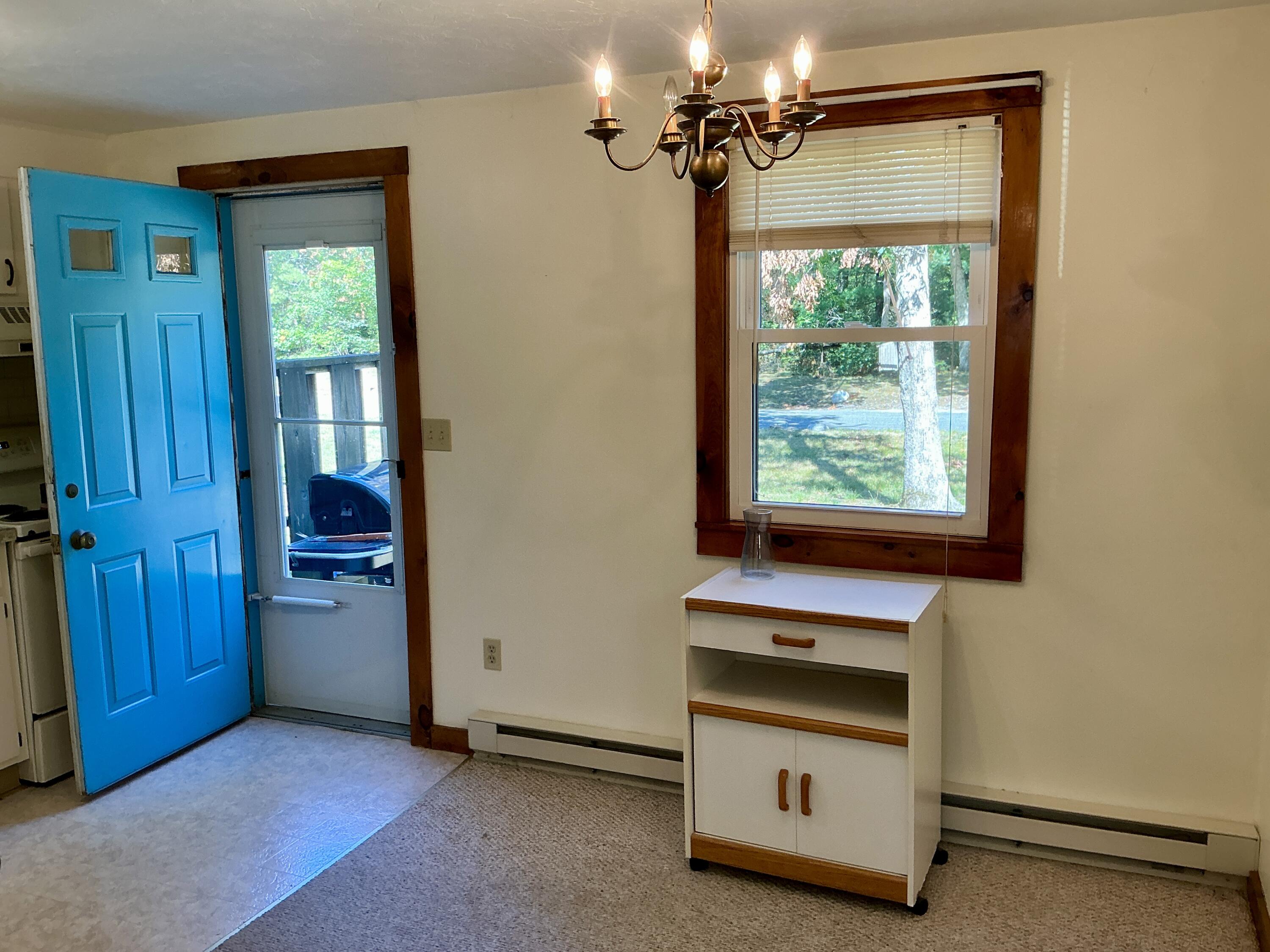 300 Falmouth Road, Unit 7E Mashpee, MA 02649 - Photo 24 of 27 an empty room with windows and closet