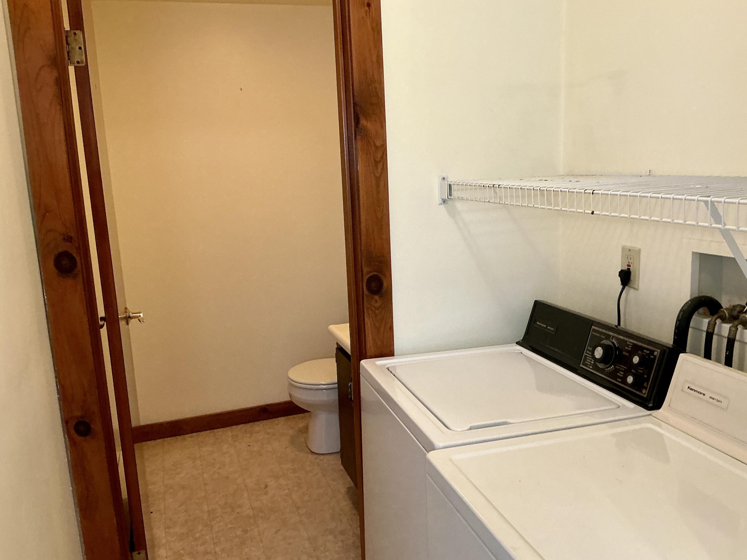 300 Falmouth Road, Unit 7E Mashpee, MA 02649 - Photo 26 of 27 a utility room with dryer and washer