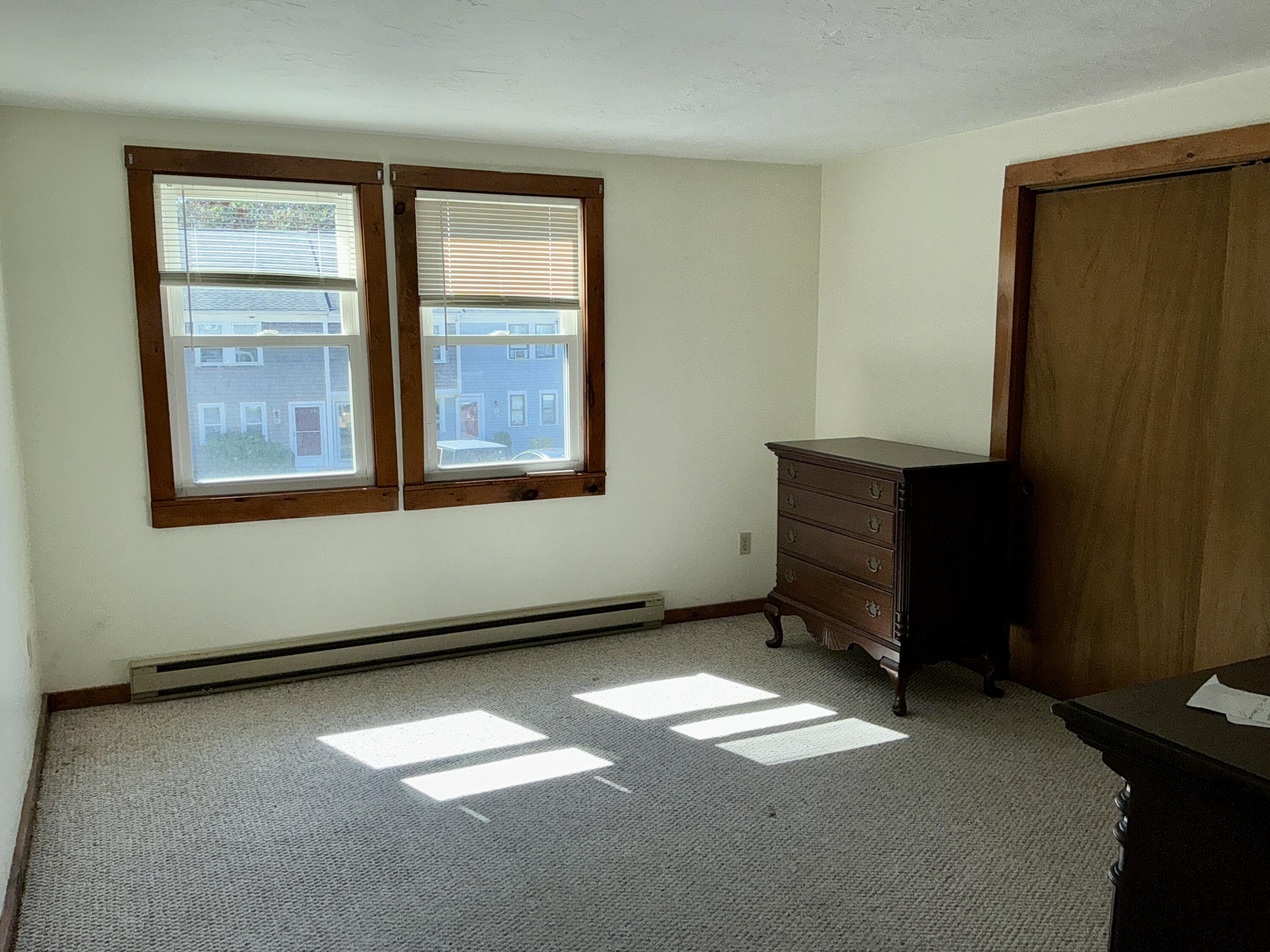 300 Falmouth Road, Unit 7E Mashpee, MA 02649 - Photo 8 of 27 an empty room with a window