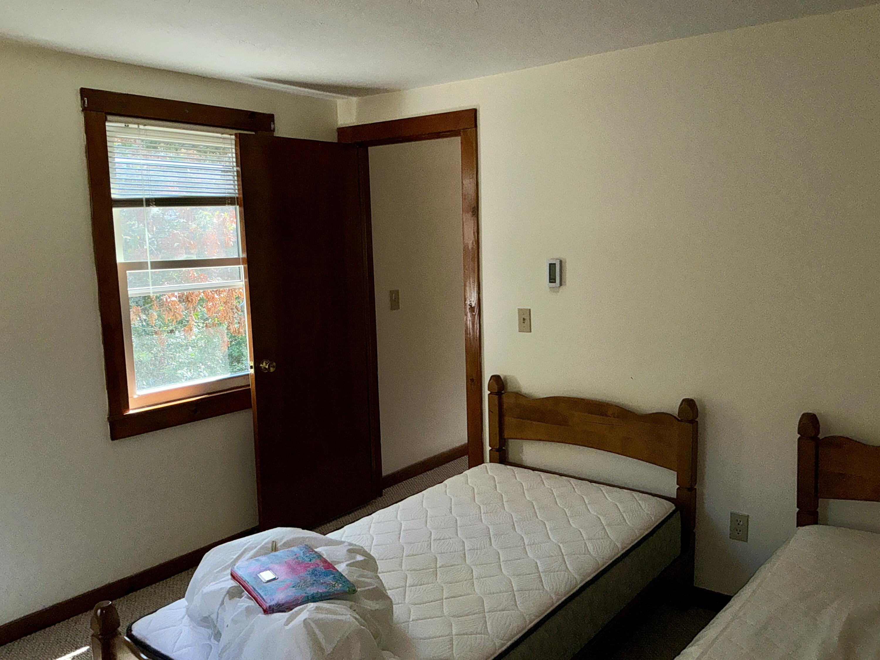 300 Falmouth Road, Unit 7E Mashpee, MA 02649 - Photo 10 of 27 a bedroom with a bed and a window