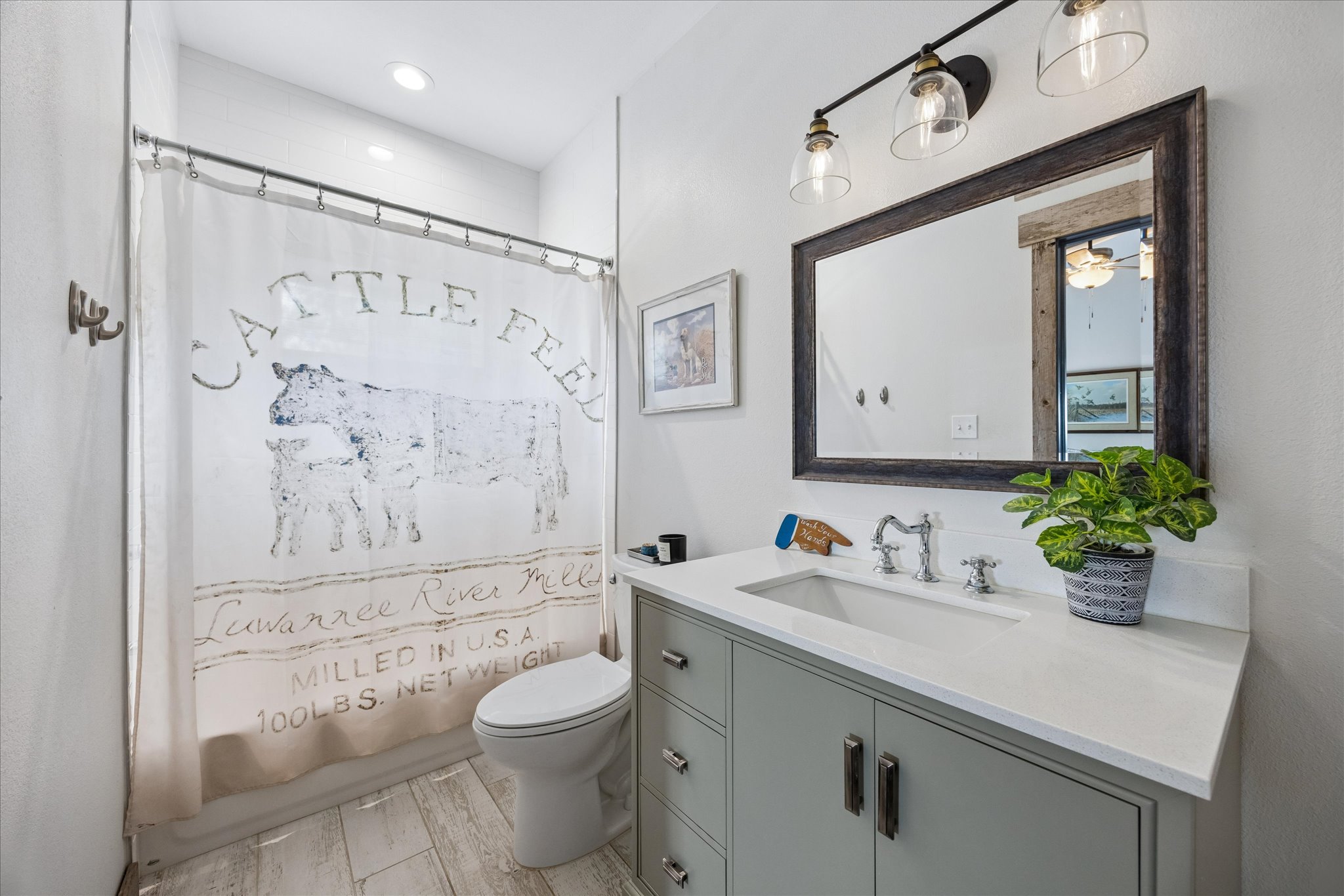 6411 West Fitzhugh Road Dripping Springs, TX 78620 - Photo 19 of 34 Bathroom featuring a light gray vanity with a white countertop and an integrated sink