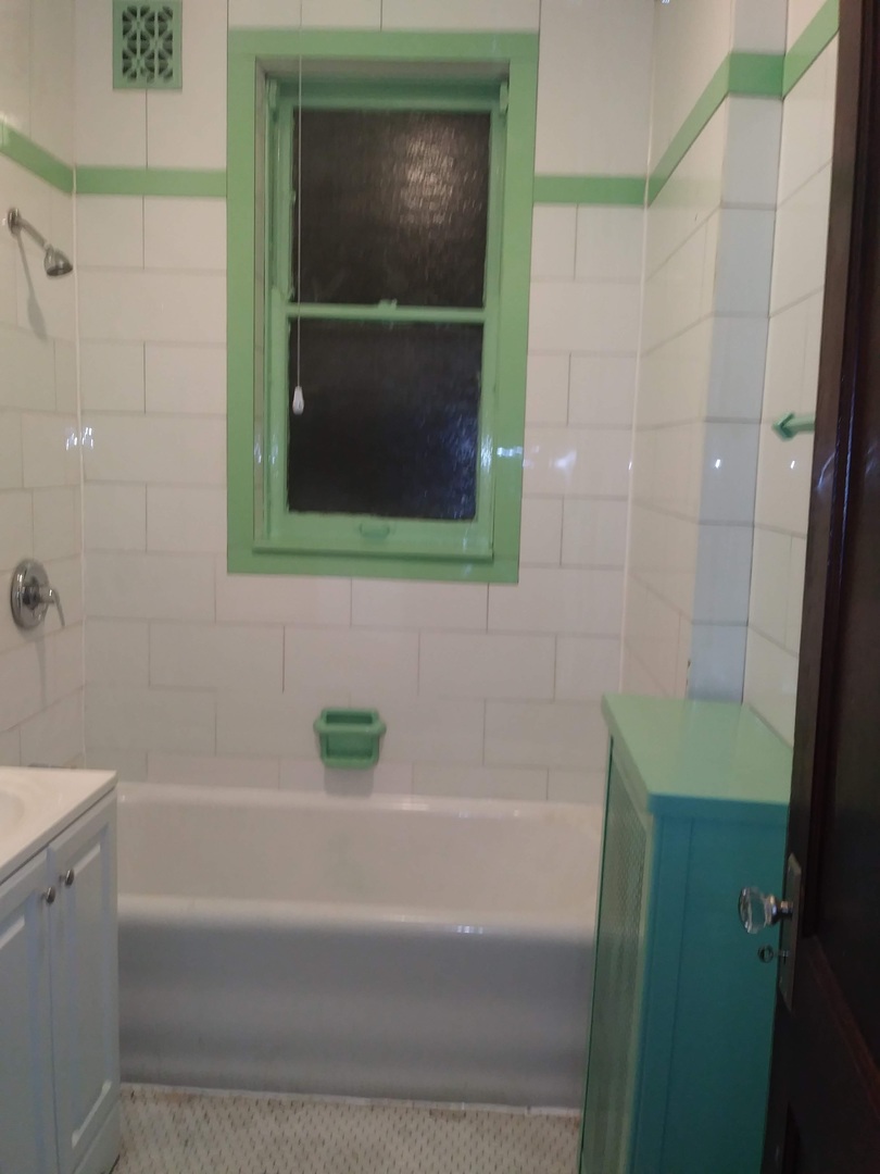 4314 West Cermak Road Chicago, IL 60623 - Photo 11 of 15 a bathroom with a bathtub and a shower