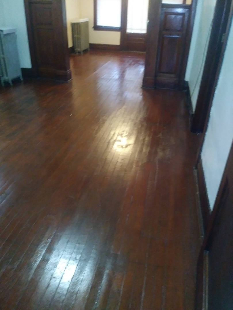 4314 West Cermak Road Chicago, IL 60623 - Photo 7 of 15 a view of empty room with wooden floor and fan