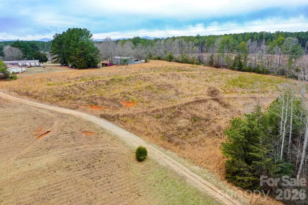 a view of a backyard of the house
