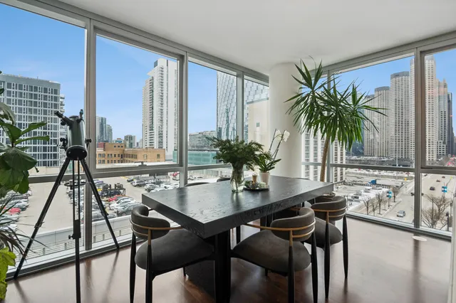 a view of a dining room with furniture and window