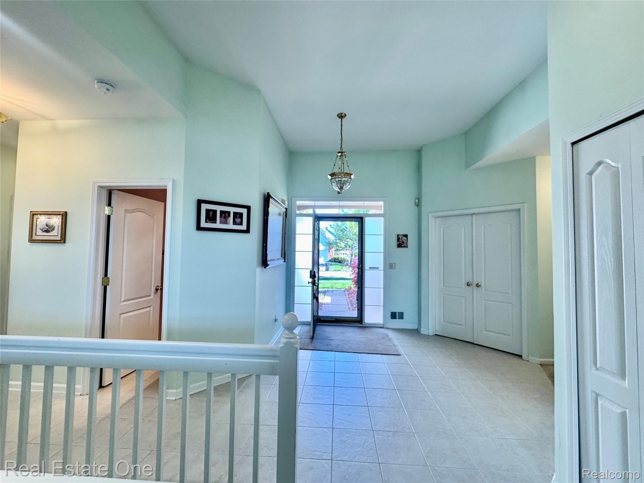 1668 South Shore Drive Rochester, MI 48307 - Photo 13 of 27 Foyer entrance with baseboards and light tile patterned floors