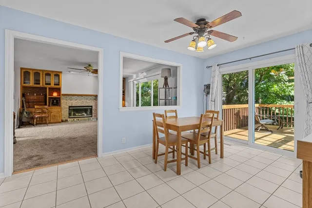 a view of a livingroom with furniture and a window