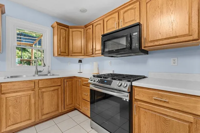a bathroom with a tub a sink and a shower