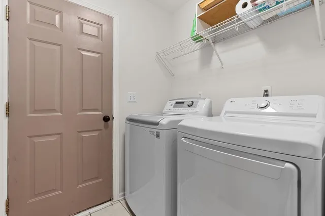 a bathroom with a tub a sink and a shower
