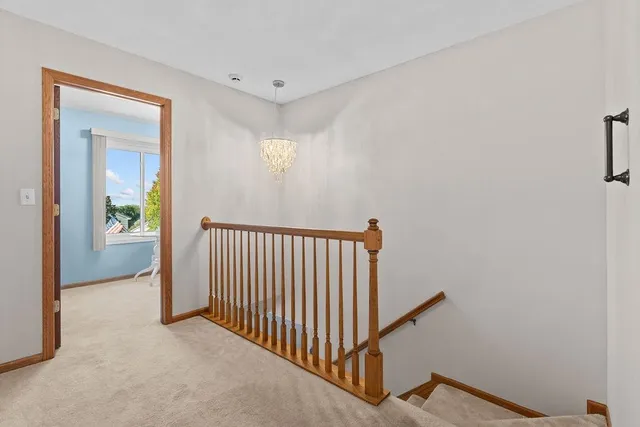 a bathroom with a tub a sink double vanity and a mirror