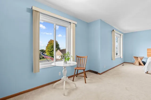 an aerial view of a house with garden space and a street view