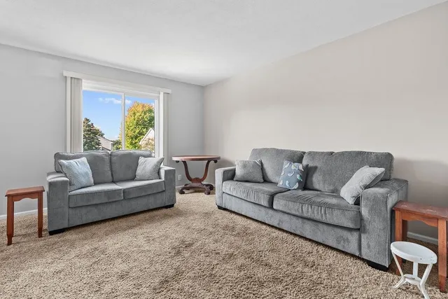 a kitchen with stainless steel appliances granite countertop a refrigerator sink and stove