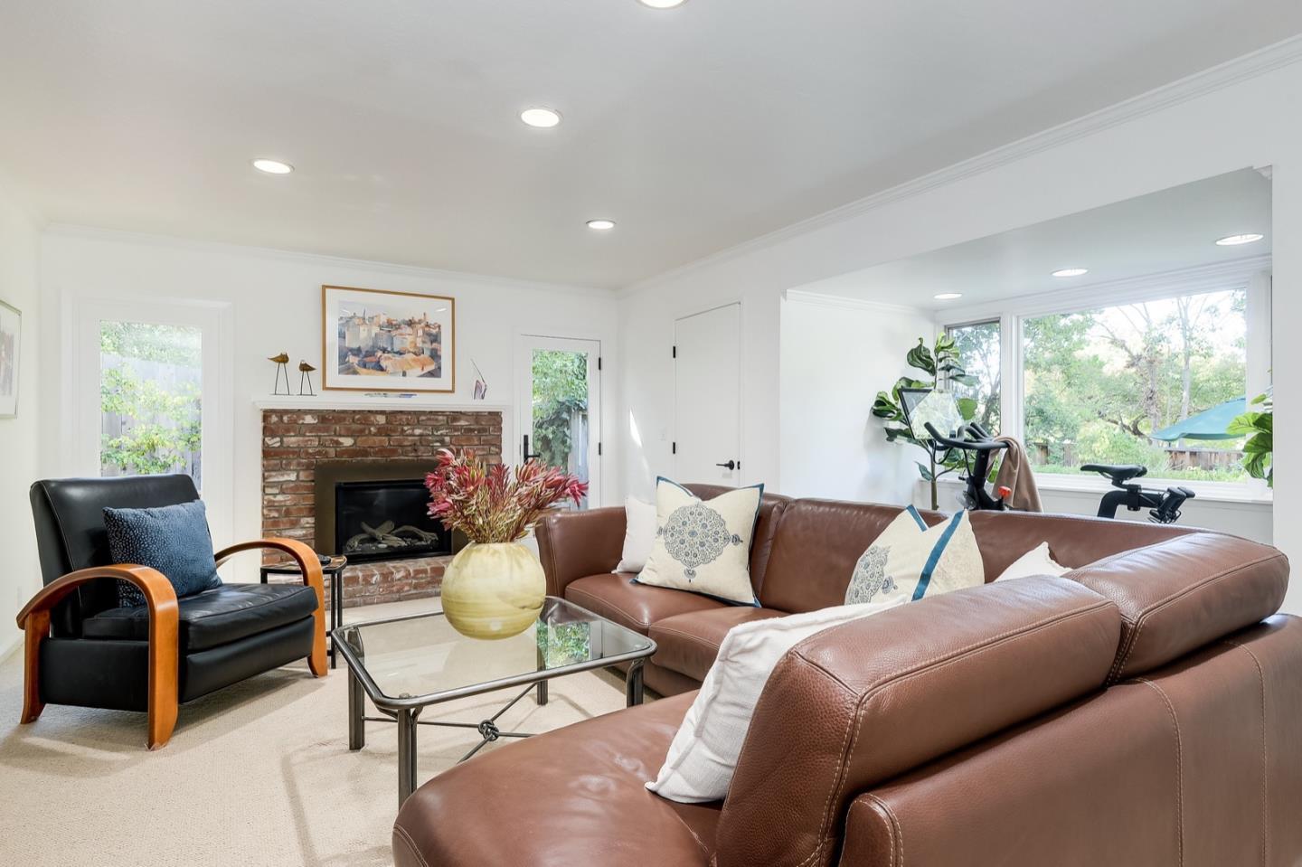 728 Tolman Drive Stanford, CA 94305 - Photo 13 of 27 a living room with furniture a fireplace and a large mirror
