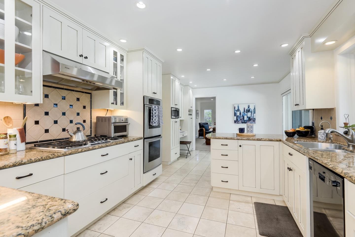 728 Tolman Drive Stanford, CA 94305 - Photo 15 of 27 a large white kitchen with stainless steel appliances granite countertop a sink and cabinets