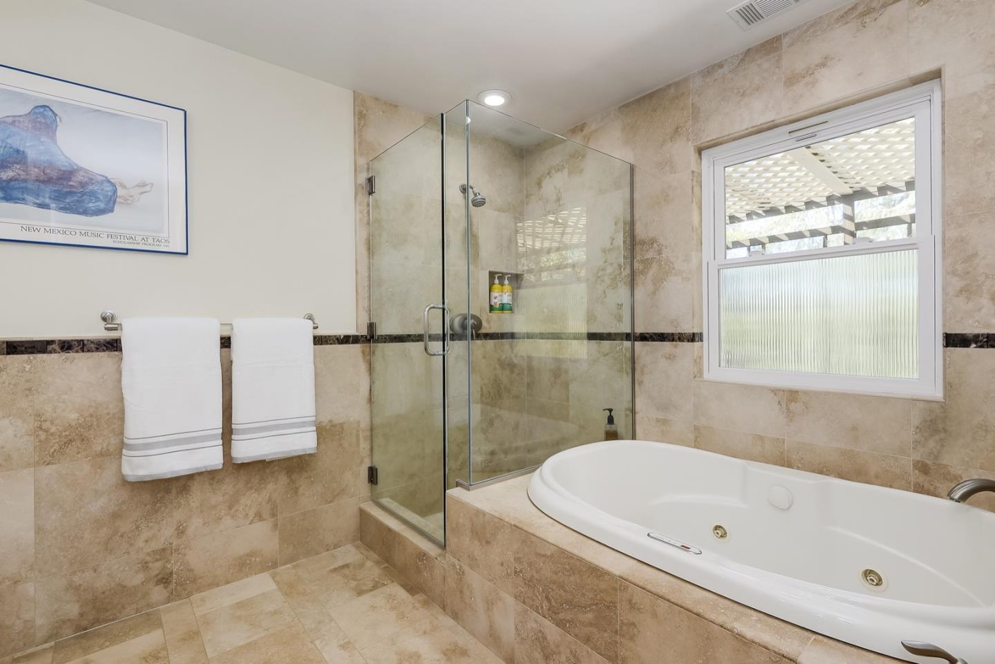 728 Tolman Drive Stanford, CA 94305 - Photo 17 of 27 a bathroom with a tub a window and a shower