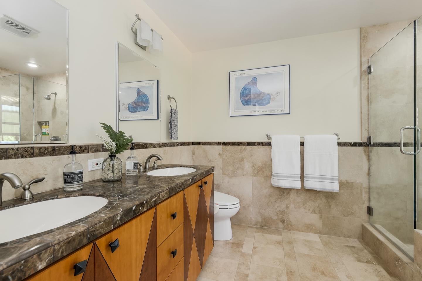 728 Tolman Drive Stanford, CA 94305 - Photo 18 of 27 a bathroom with a granite countertop sink a toilet a mirror and shower