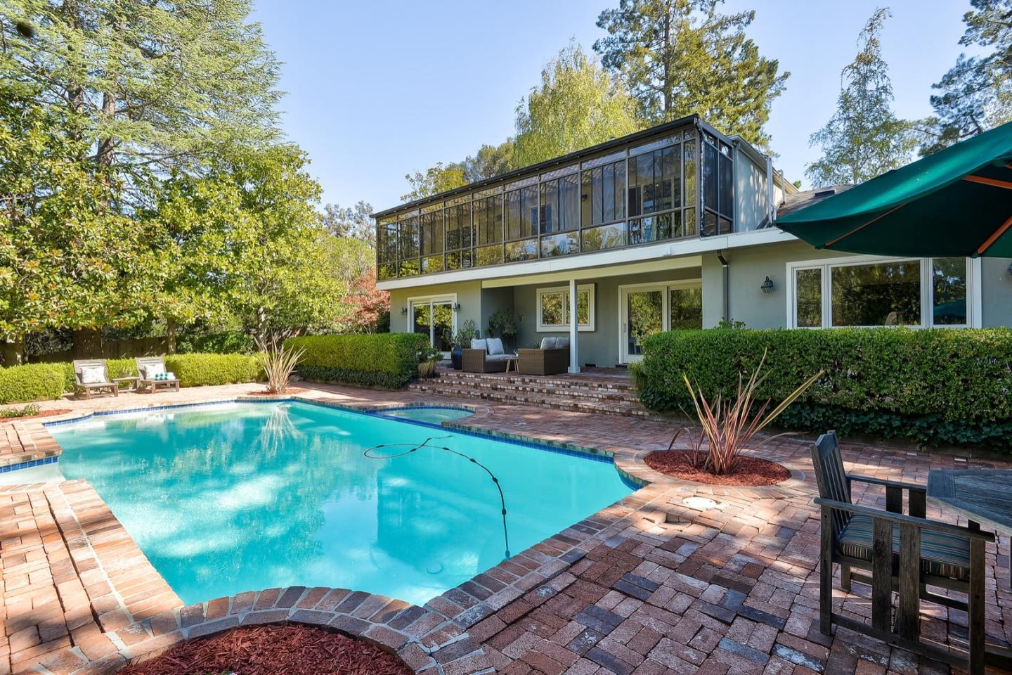 728 Tolman Drive Stanford, CA 94305 - Photo 22 of 27 a front view of a house with swimming pool having outdoor seating