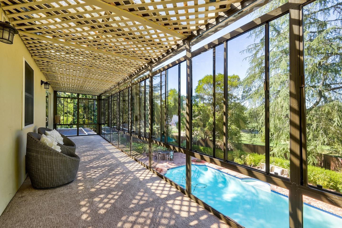 728 Tolman Drive Stanford, CA 94305 - Photo 25 of 27 a view of a porch with furniture and floor to ceiling window