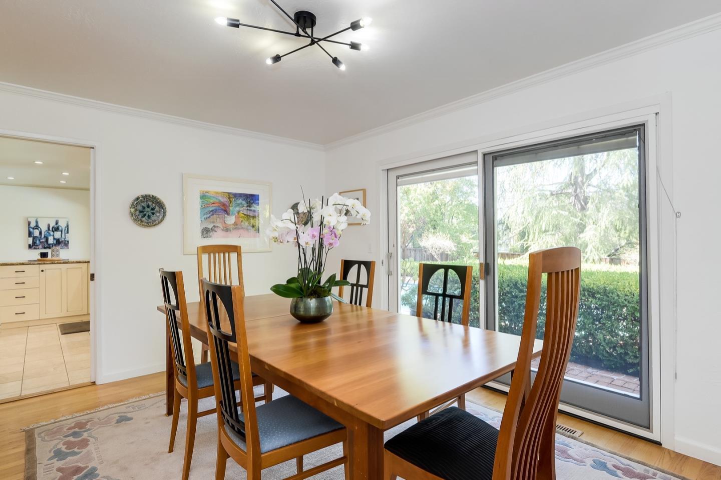 728 Tolman Drive Stanford, CA 94305 - Photo 5 of 27 a view of a dining room with furniture window and wooden floor