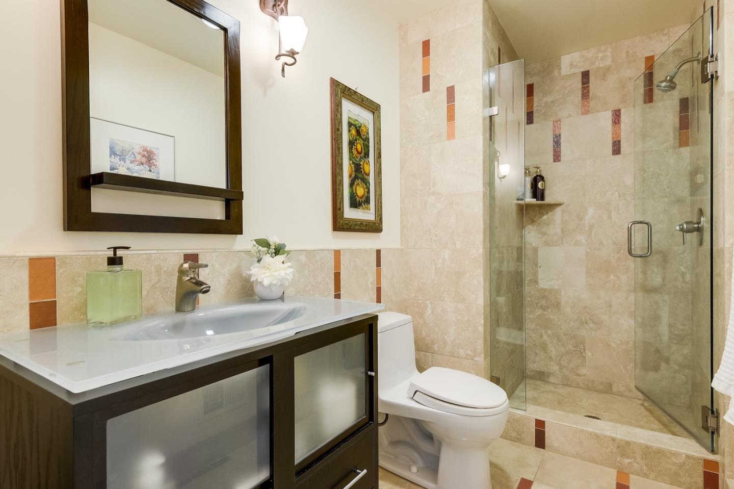 728 Tolman Drive Stanford, CA 94305 - Photo 9 of 27 a bathroom with a sink toilet and shower