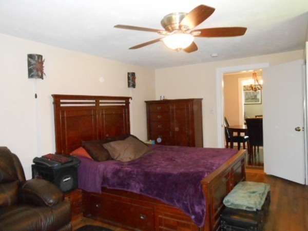 211 Randall Road Stow, MA 01775 - Photo 15 of 30 a bedroom with a bed couch and dresser