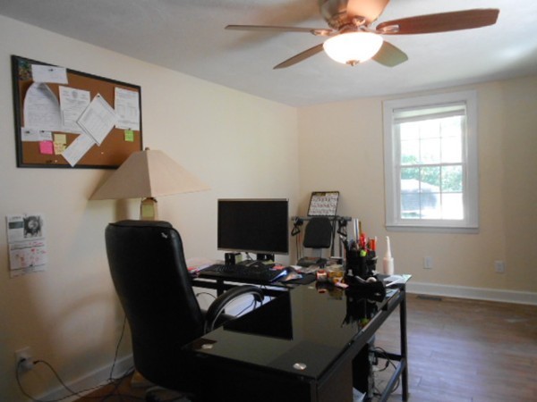 211 Randall Road Stow, MA 01775 - Photo 16 of 30 a view of a workspace with furniture and a window