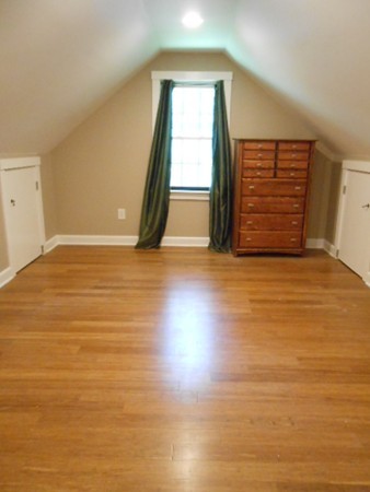 211 Randall Road Stow, MA 01775 - Photo 23 of 30 a view of an empty room with wooden floor and a window