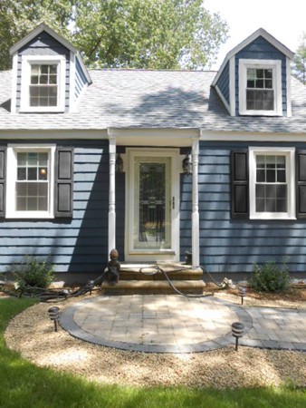 211 Randall Road Stow, MA 01775 - Photo 27 of 30 a front view of a house with garden