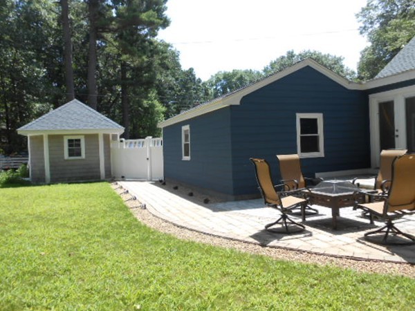 211 Randall Road Stow, MA 01775 - Photo 28 of 30 a backyard of a house with table and chairs