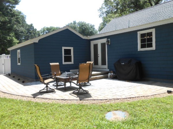 211 Randall Road Stow, MA 01775 - Photo 29 of 30 a view of table and chairs in backyard of house