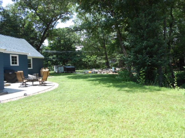 211 Randall Road Stow, MA 01775 - Photo 30 of 30 a view of a house with backyard and sitting area