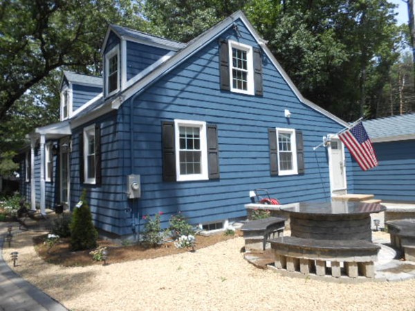 211 Randall Road Stow, MA 01775 - Photo 3 of 30 a backyard of house with outdoor seating