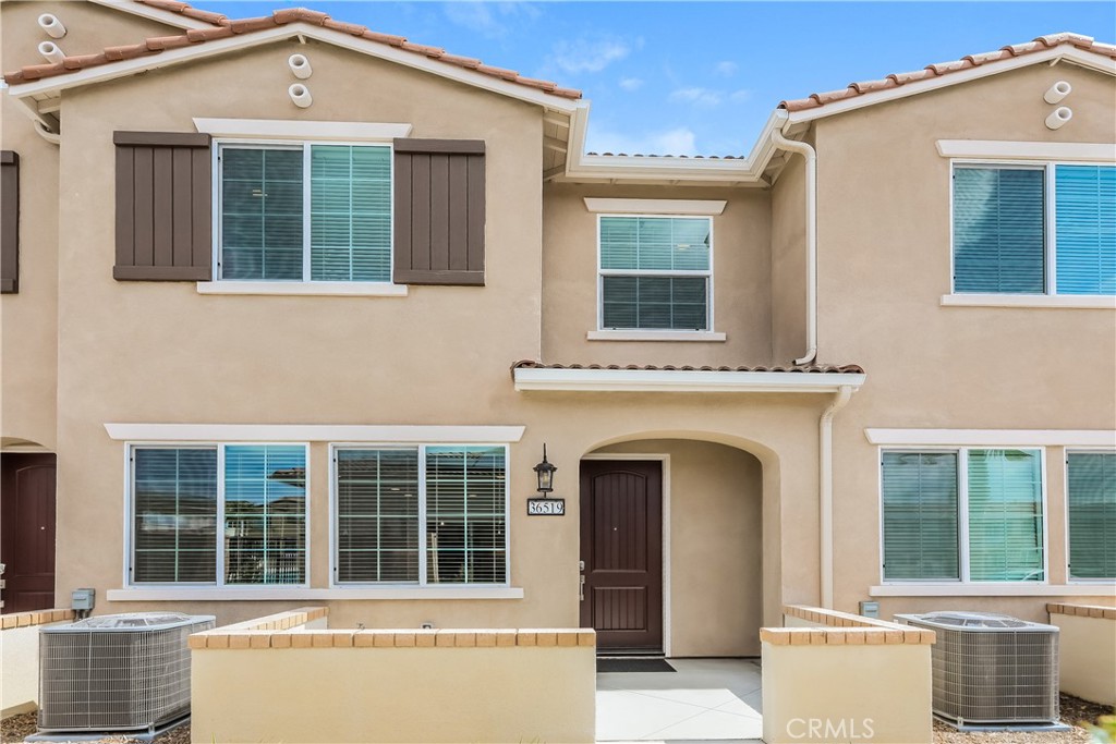36519 Hasta Way Wildomar, CA 92595 - Photo 1 of 32 a front view of a house with large windows