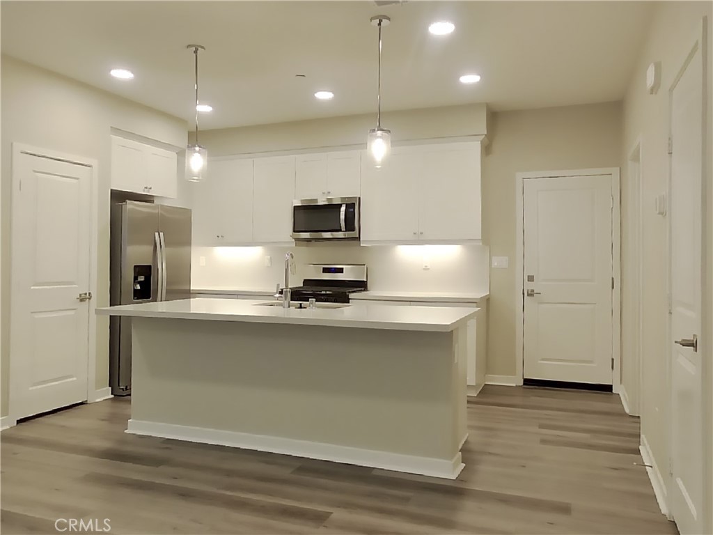36519 Hasta Way Wildomar, CA 92595 - Photo 5 of 32 a view of kitchen with stainless steel appliances wooden floor and refrigerator