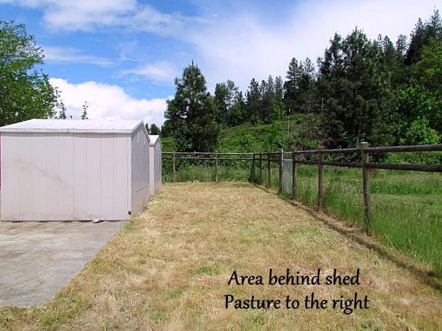 6710 North Applegate Road Grants Pass, OR 97527 - Photo 29 of 33 a view of swimming pool with a big yard and a bench in front of it